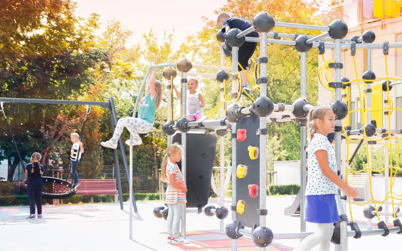 Hotel Aquarius Spa Kolobrzeg Exterior photo Children playing on a climbing frame